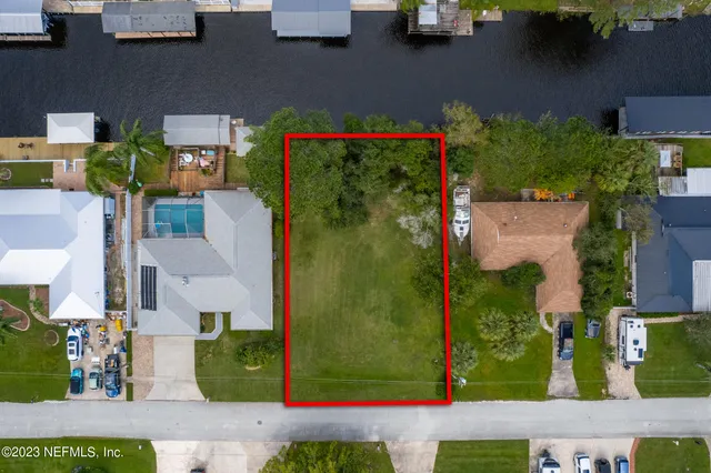 an aerial view of houses with yard