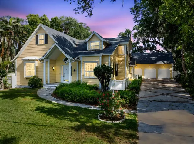 a front view of a house with garden
