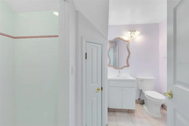 a view of a street with a fence