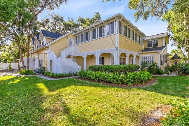an outdoor space with seating area and trees around