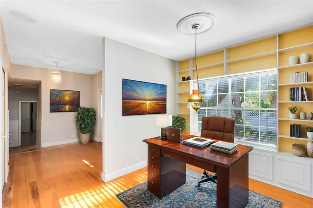 a workspace with furniture and window