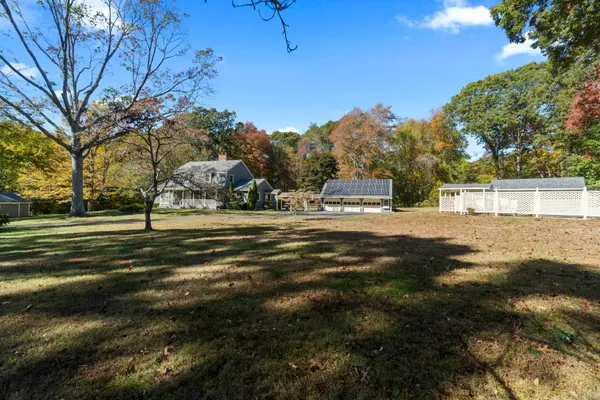 a view of the house with a big yard