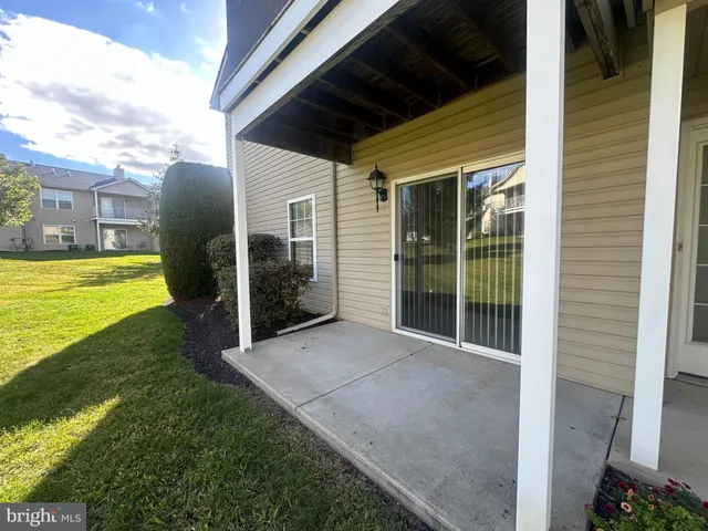a view of a house with backyard of a house