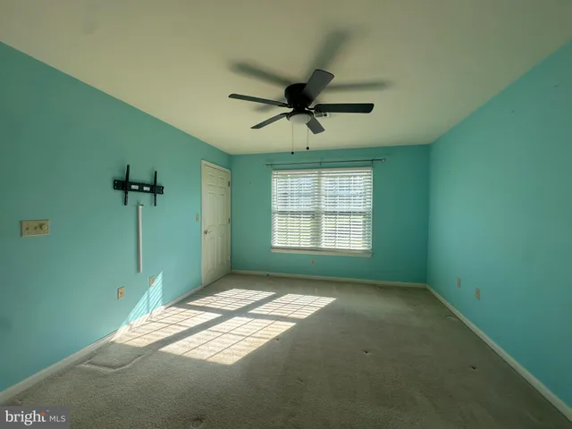 a view of empty room with windows