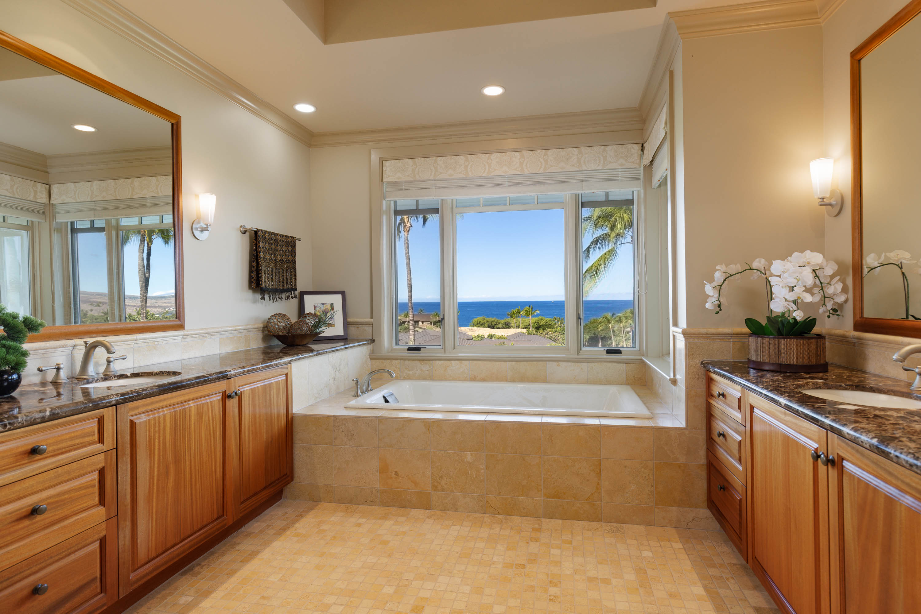 62-3979 Kaunaoa Iki Road, Unit 2A Kamuela, HI 96743 - Photo 11 of 17 a large kitchen with kitchen island granite countertop a large counter top a sink a stove and a refrigerator