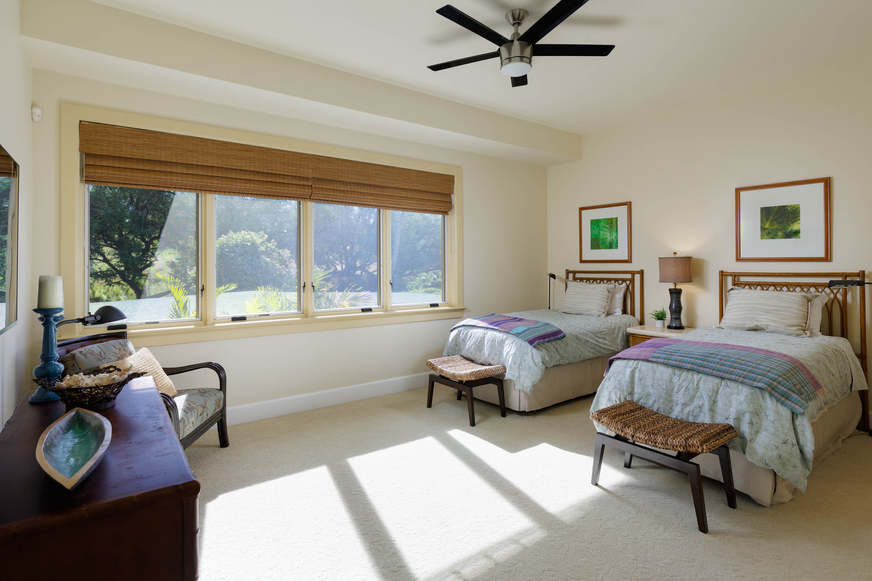 62-3979 Kaunaoa Iki Road, Unit 2A Kamuela, HI 96743 - Photo 12 of 17 a spacious bedroom with a bed and a large window