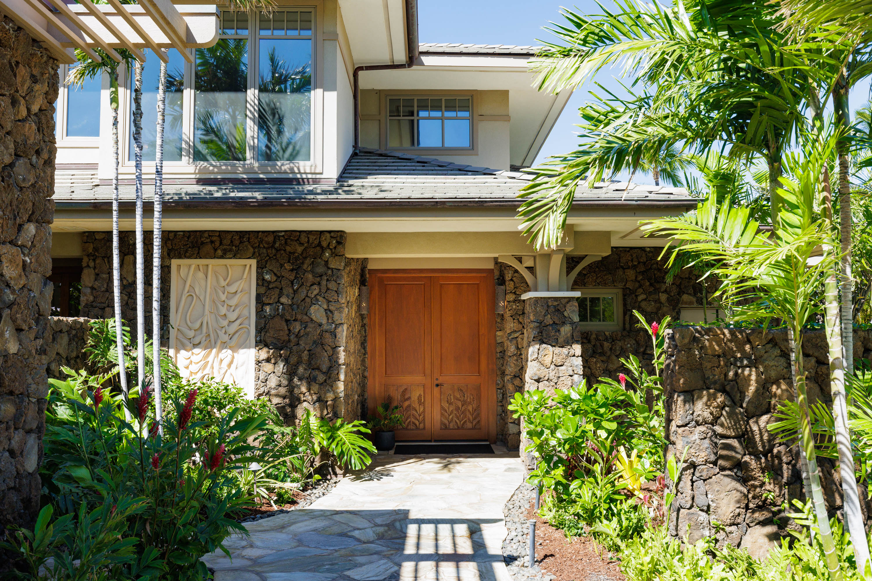 62-3979 Kaunaoa Iki Road, Unit 2A Kamuela, HI 96743 - Photo 16 of 17 a house with a tree in front of it