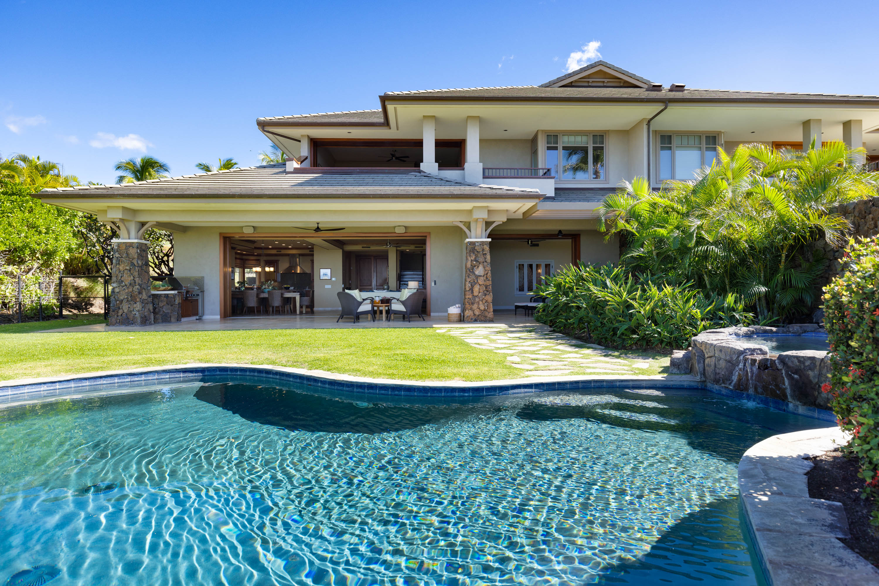 62-3979 Kaunaoa Iki Road, Unit 2A Kamuela, HI 96743 - Photo 17 of 17 a view of a house with swimming pool and yard