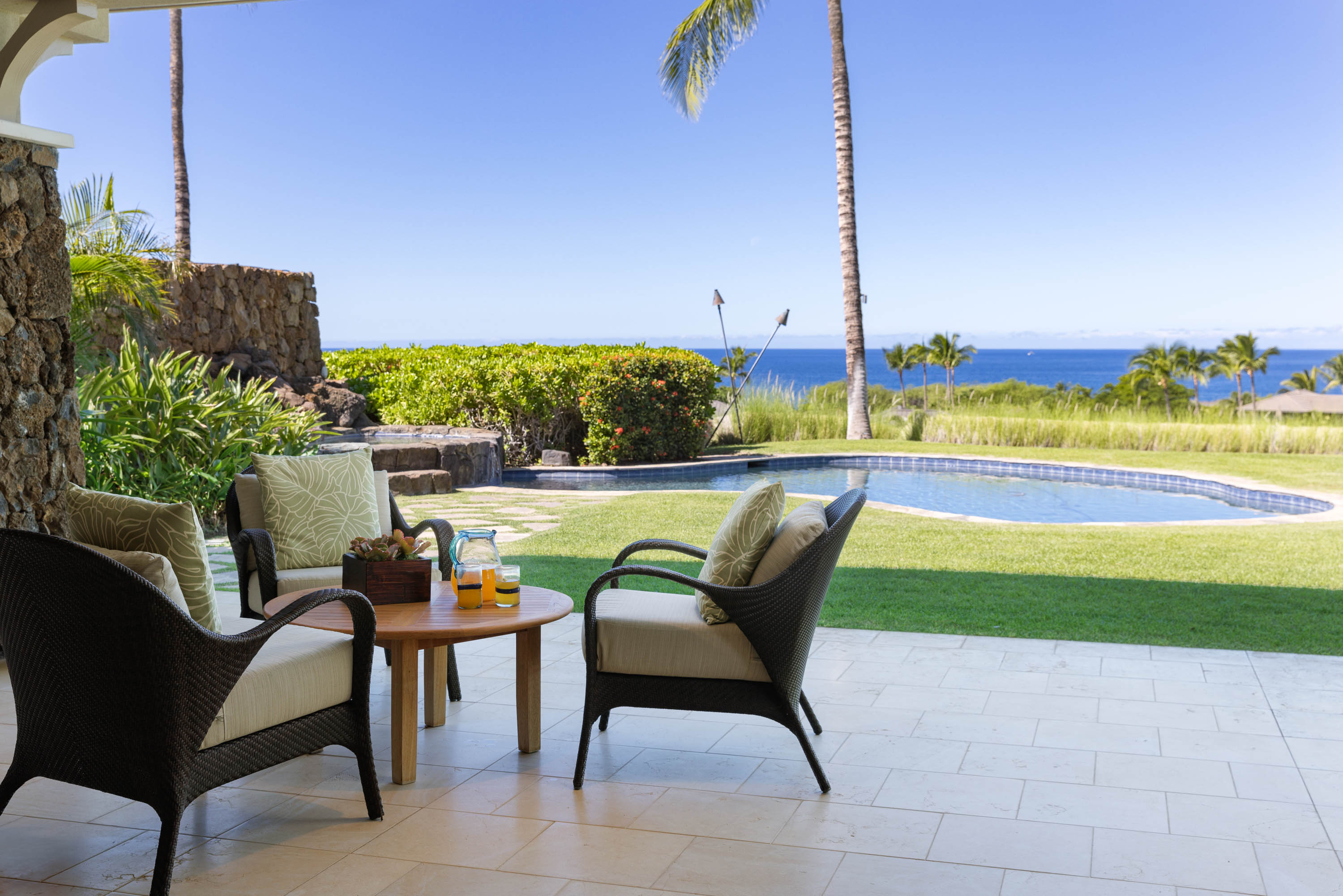 62-3979 Kaunaoa Iki Road, Unit 2A Kamuela, HI 96743 - Photo 2 of 17 a view of a swimming pool with chairs