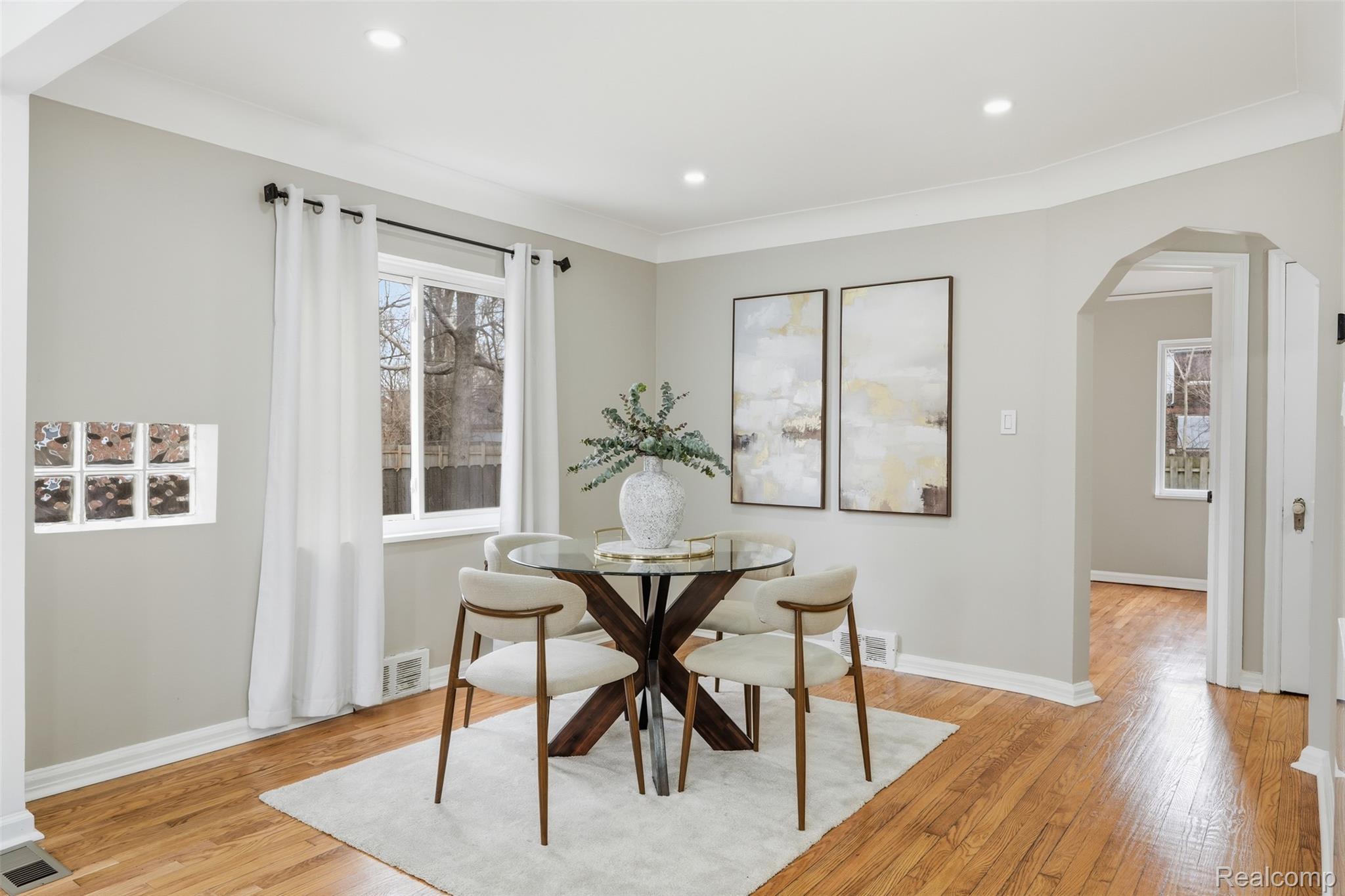 16636 Ardmore Street Detroit, MI 48235 - Photo 6 of 27 Dining space featuring arched walkways, light wood-style flooring, and recessed lighting
