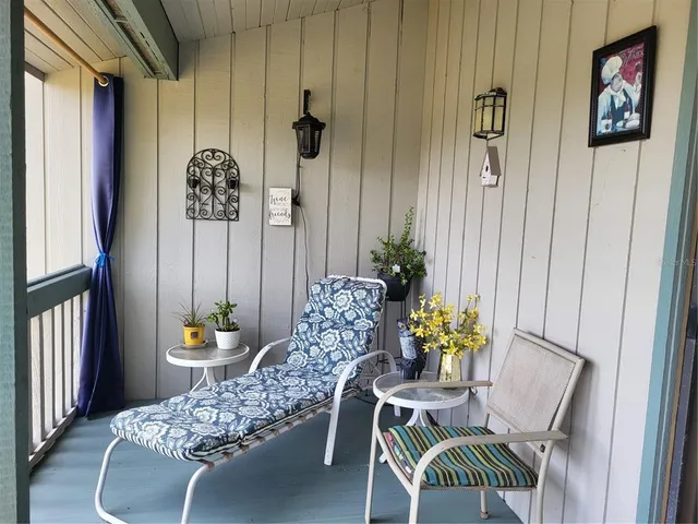 a view of a dining room with furniture window and flowerpot