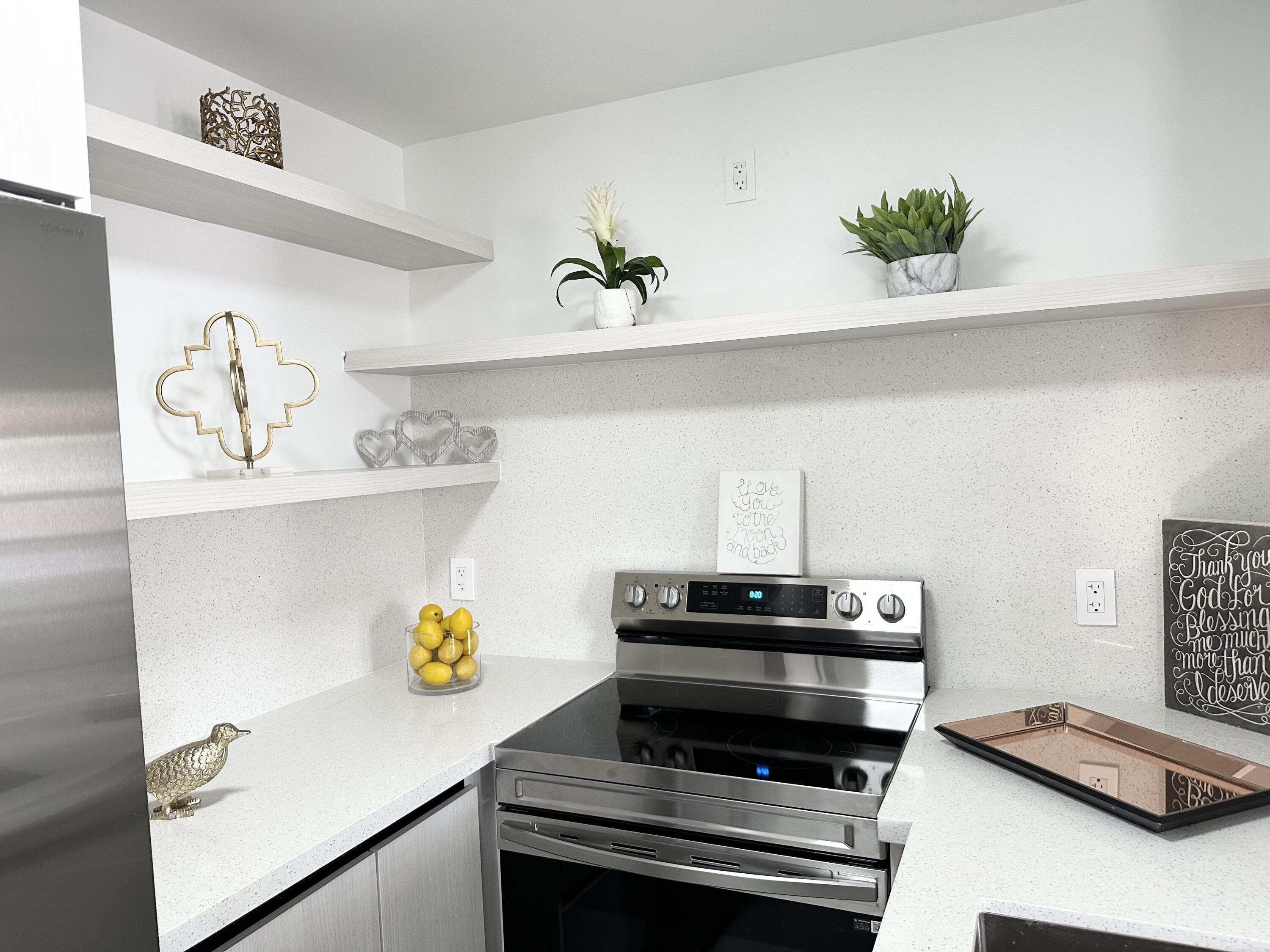 10033 Winding Lake Road, Unit 204 Sunrise, FL 33351 - Photo 13 of 37 a view of kitchen appliances and wooden floor