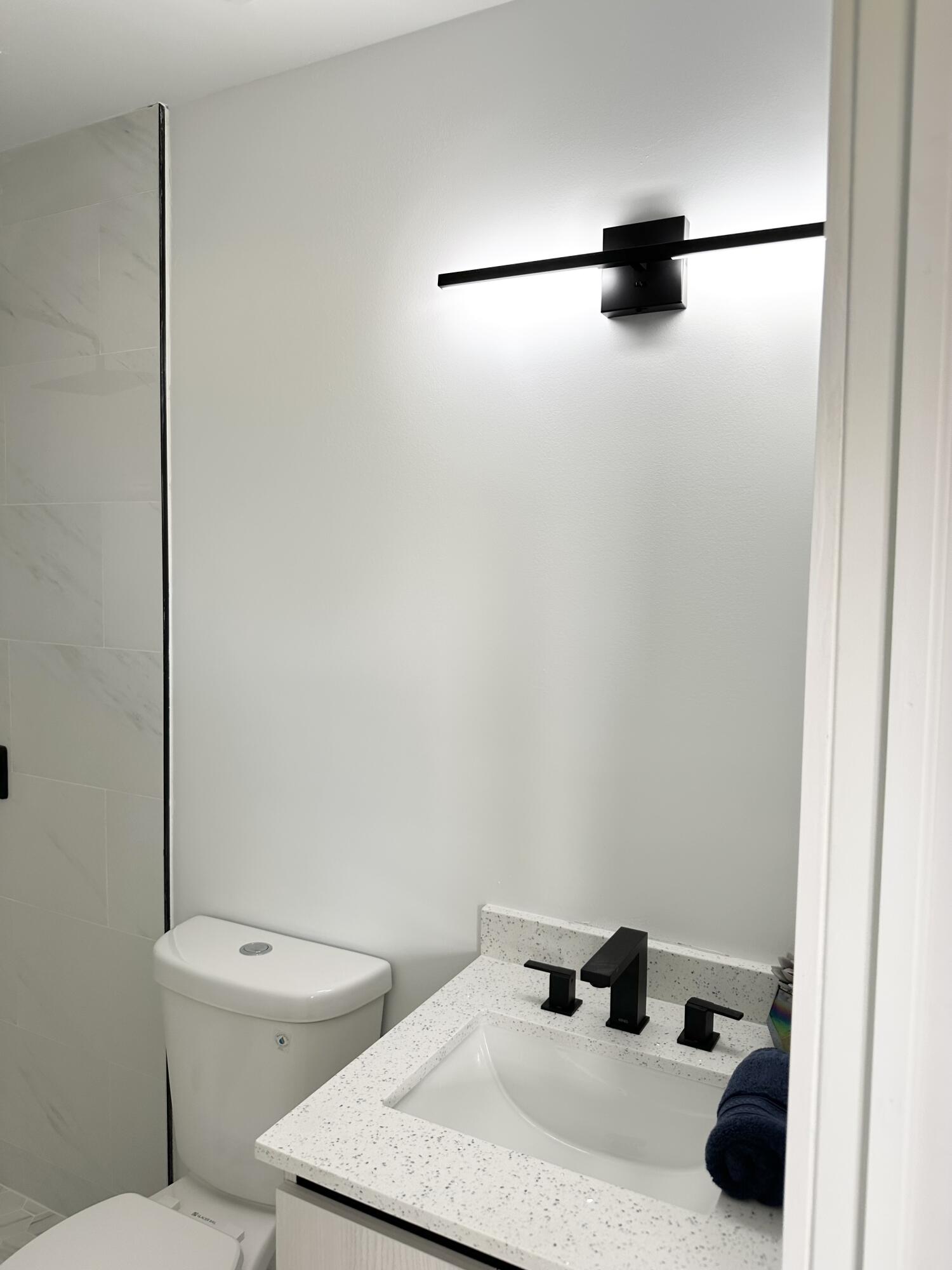 10033 Winding Lake Road, Unit 204 Sunrise, FL 33351 - Photo 15 of 37 a bathroom with a toilet and a shower