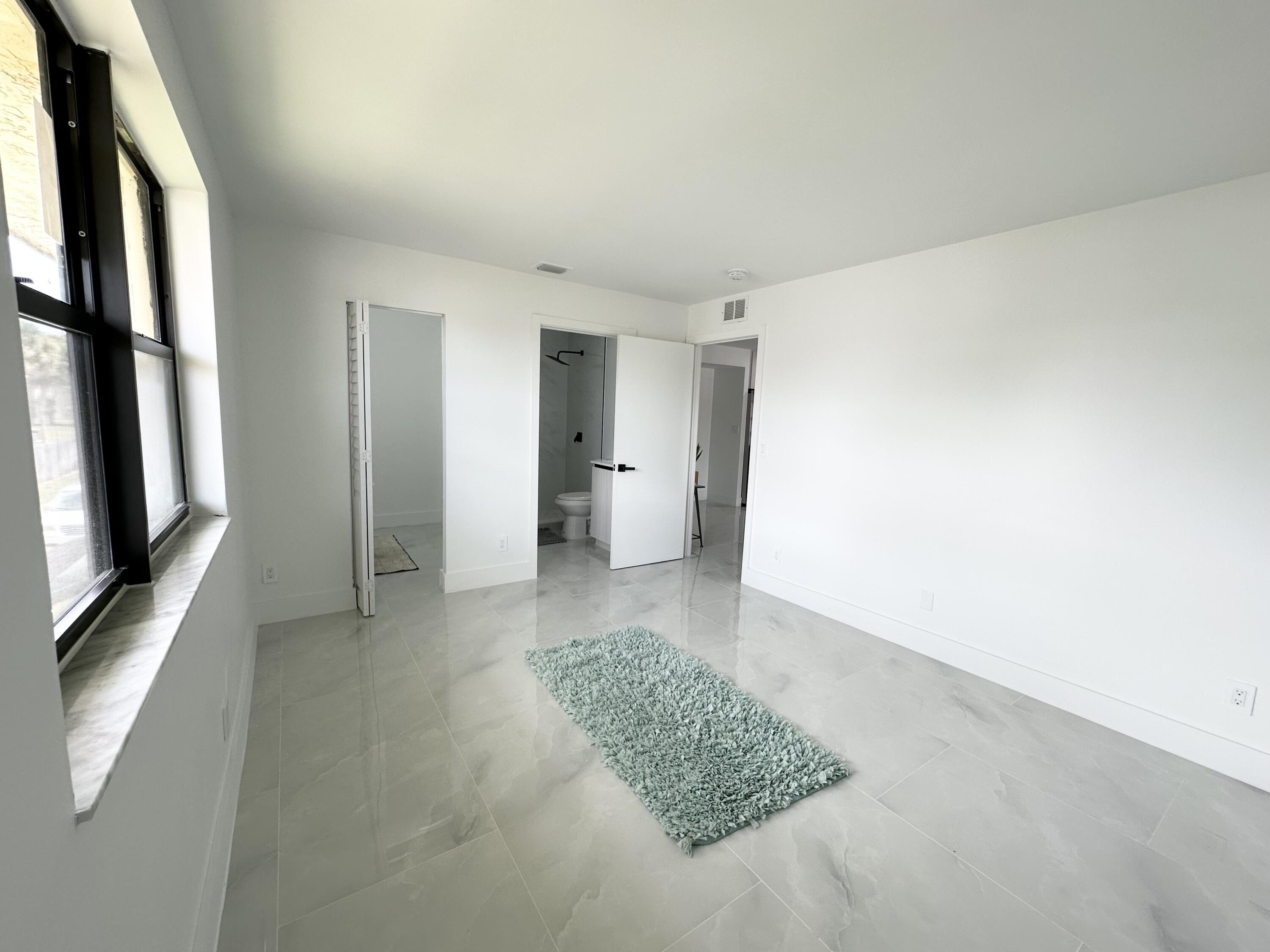 10033 Winding Lake Road, Unit 204 Sunrise, FL 33351 - Photo 19 of 37 a view of an empty room and a bathroom