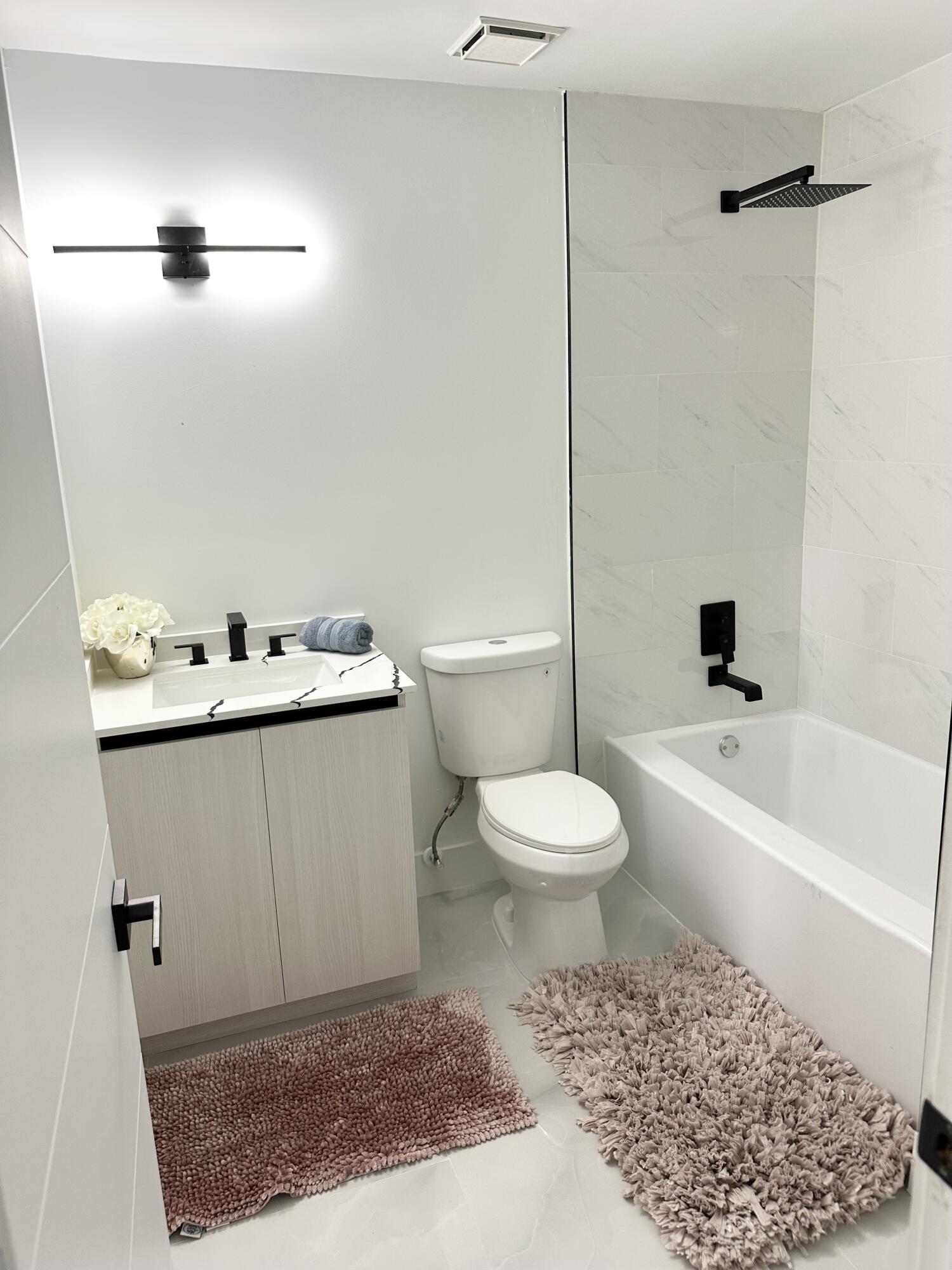 10033 Winding Lake Road, Unit 204 Sunrise, FL 33351 - Photo 28 of 37 a bathroom with a toilet and a shower