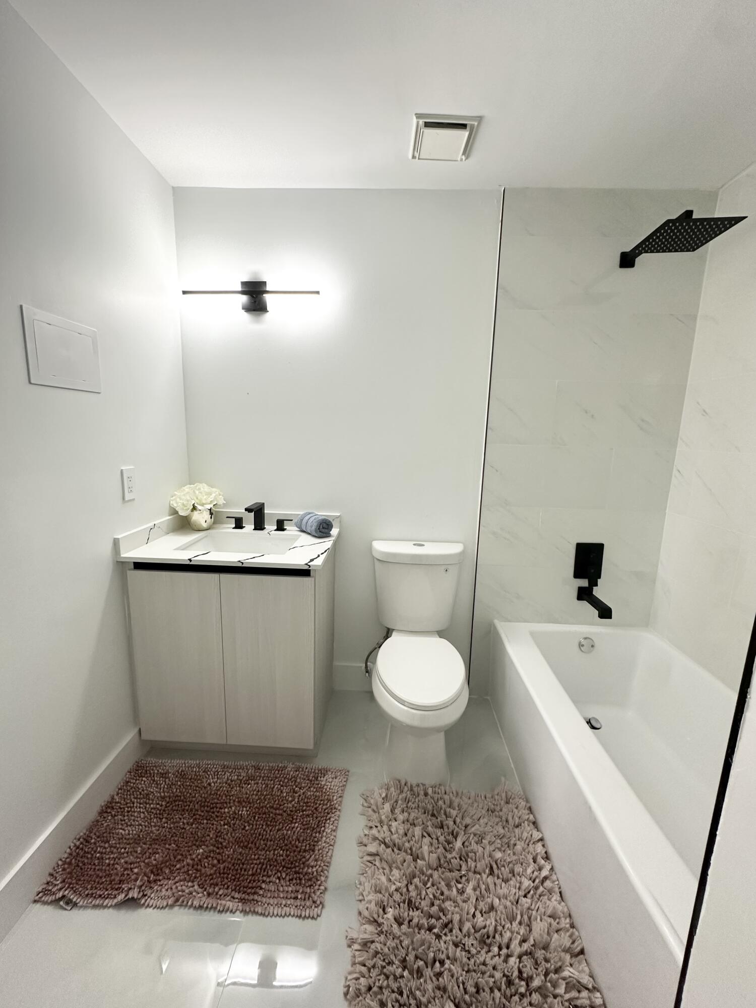 10033 Winding Lake Road, Unit 204 Sunrise, FL 33351 - Photo 29 of 37 a bathroom with a sink a toilet and shower