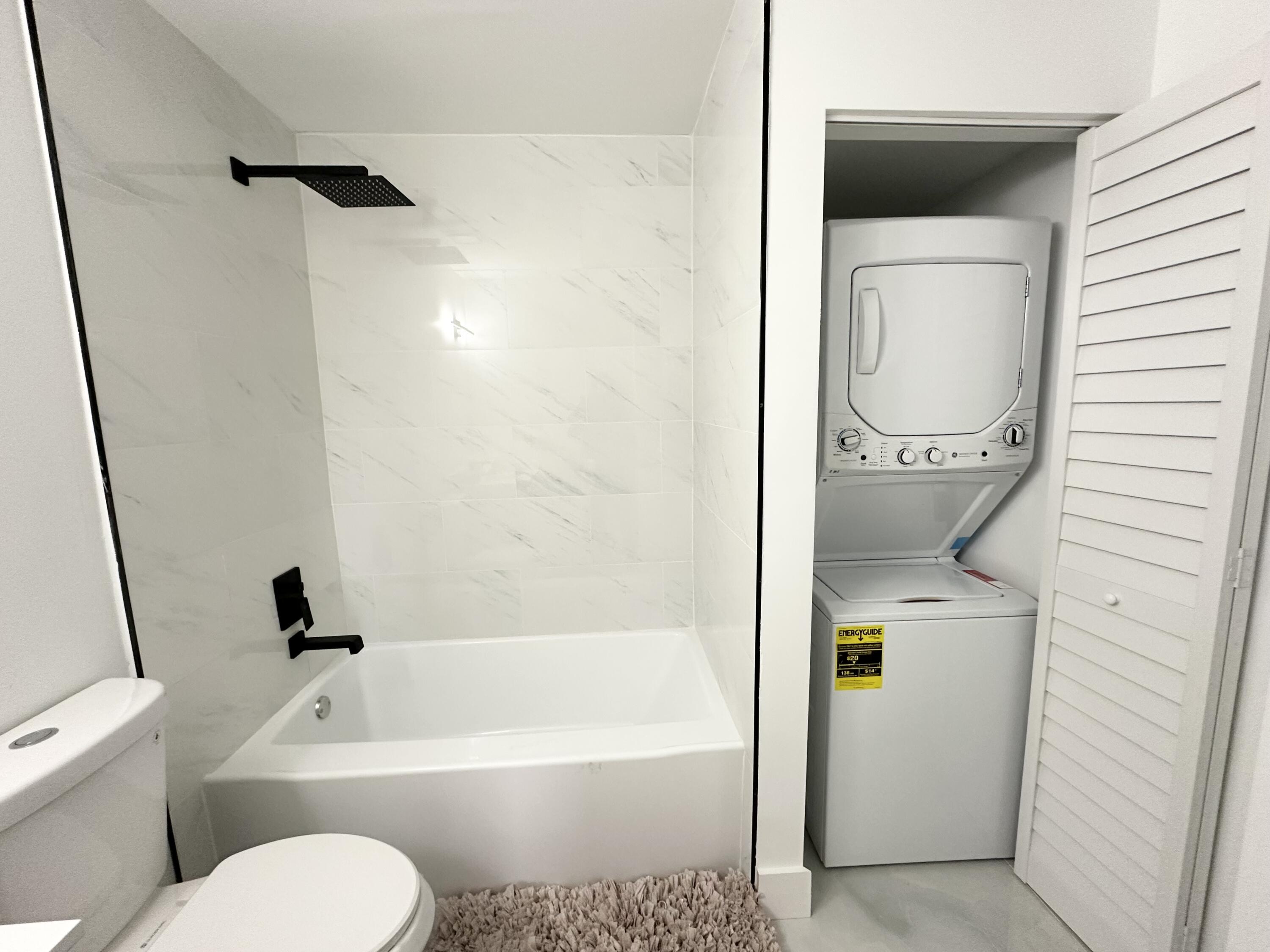 10033 Winding Lake Road, Unit 204 Sunrise, FL 33351 - Photo 31 of 37 a bathroom with a toilet and a bathtub