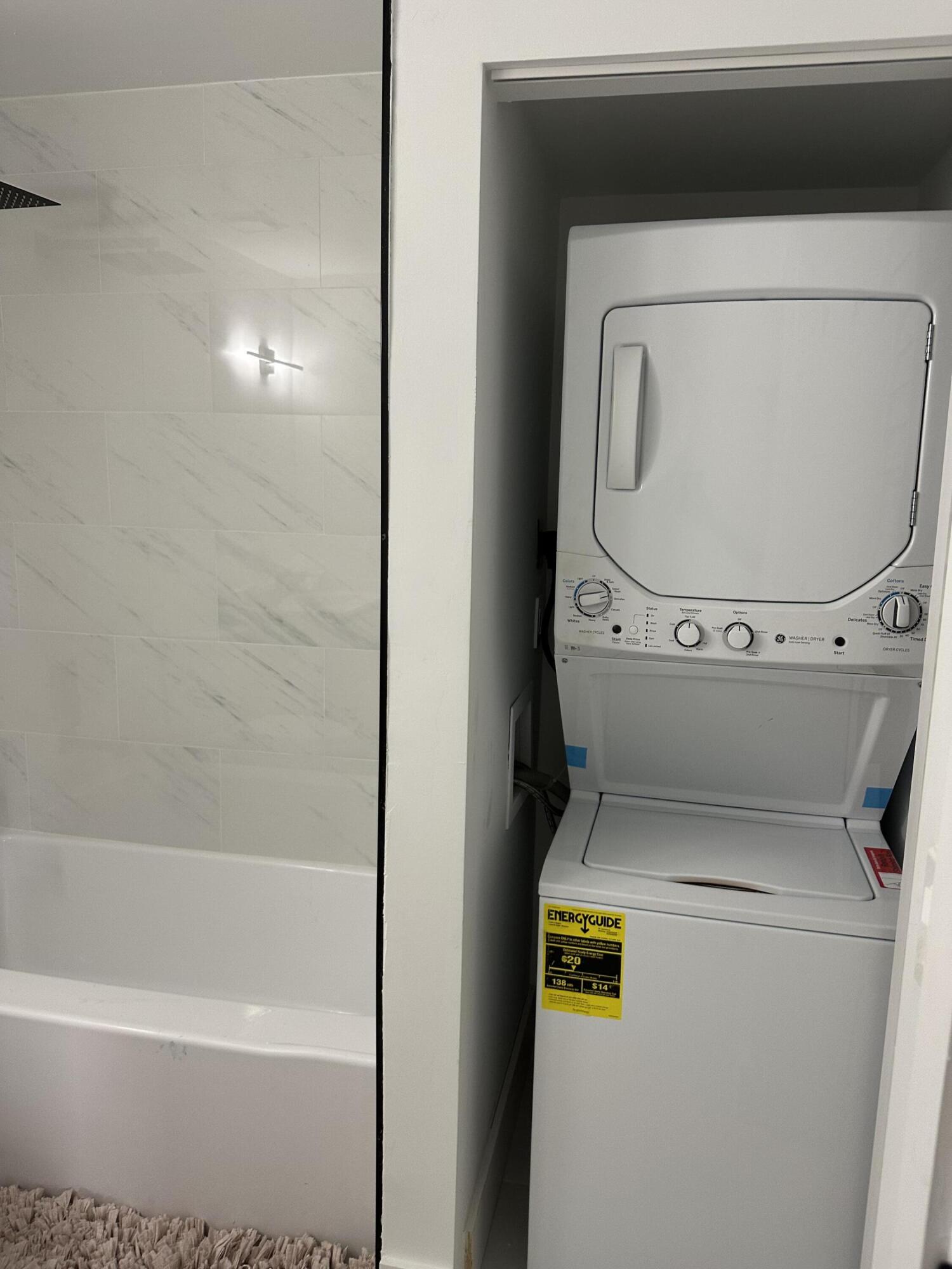 10033 Winding Lake Road, Unit 204 Sunrise, FL 33351 - Photo 32 of 37 a utility room with dryer and washer