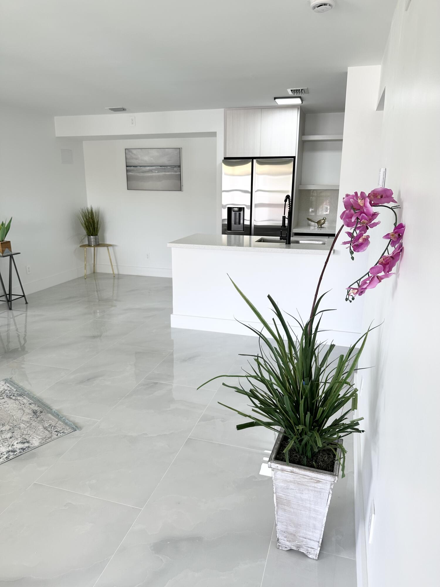 10033 Winding Lake Road, Unit 204 Sunrise, FL 33351 - Photo 6 of 37 a white bath tub sitting in a bathroom next to a window