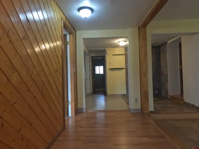 a view of gallery with wooden floor