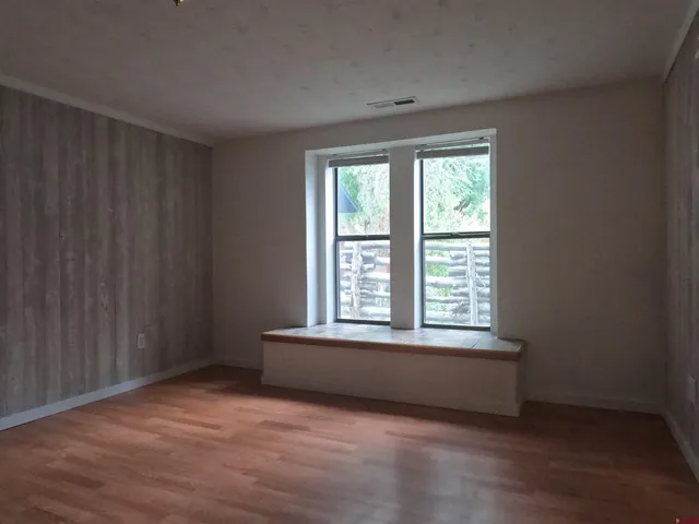a view of an empty room with a window