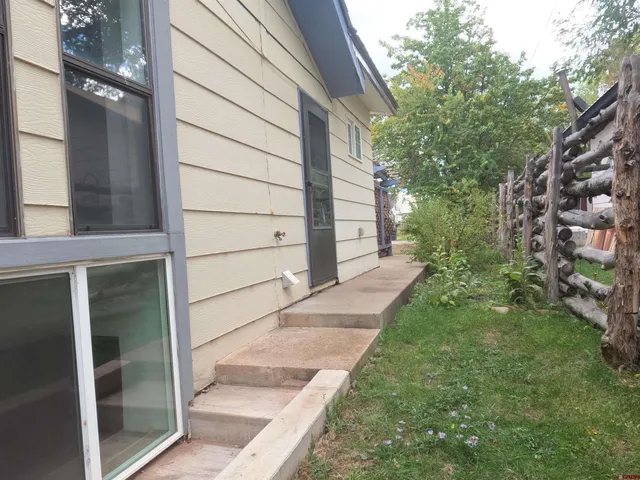 a view of a back yard of the house