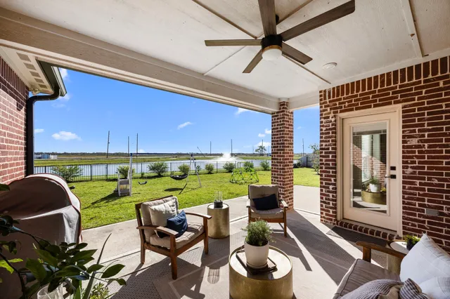 a view of a patio with a yard