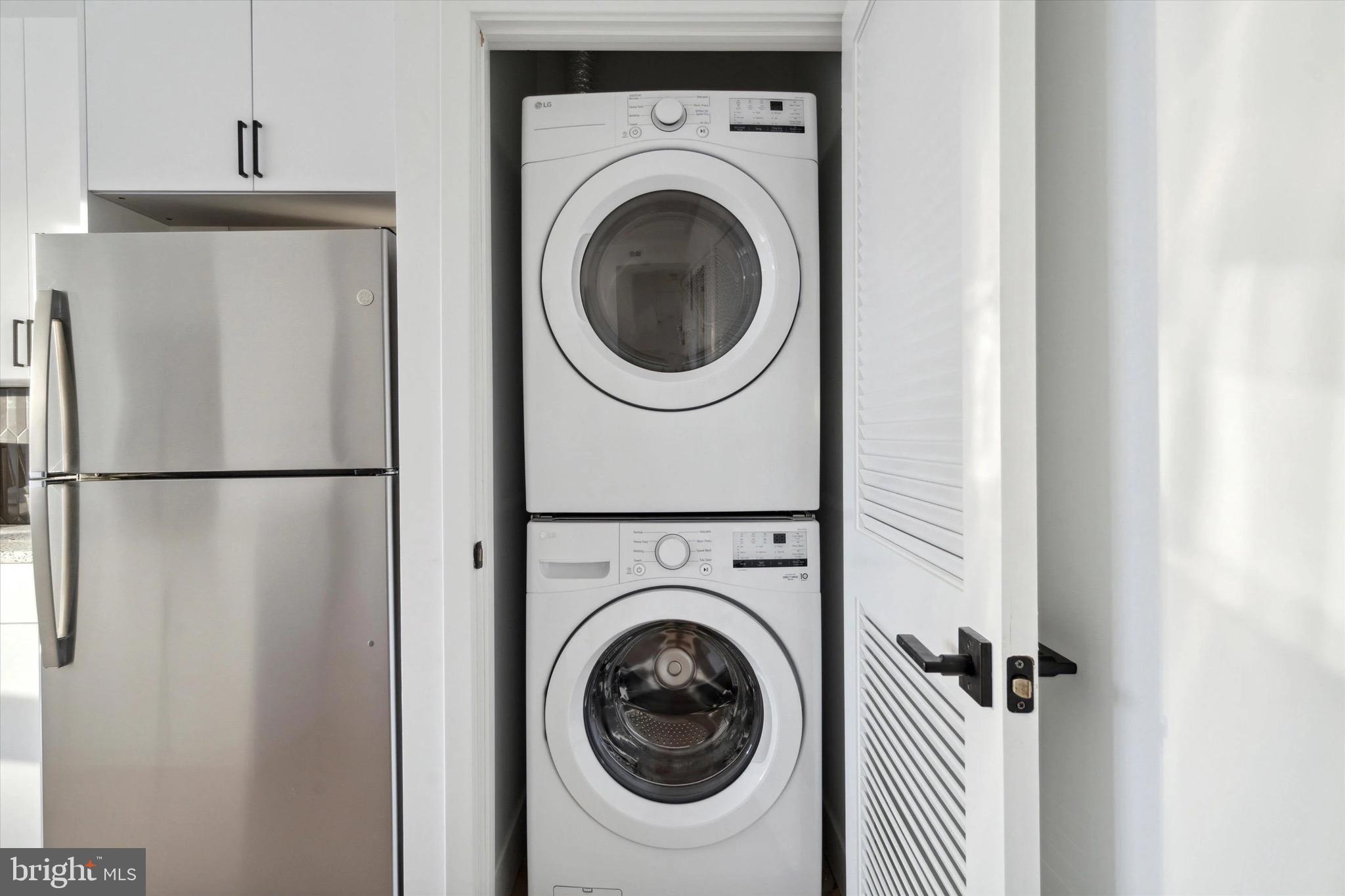1643 North 2nd Street, Unit 302 Philadelphia, PA 19122 - Photo 39 of 40 a utility room with dryer and washer