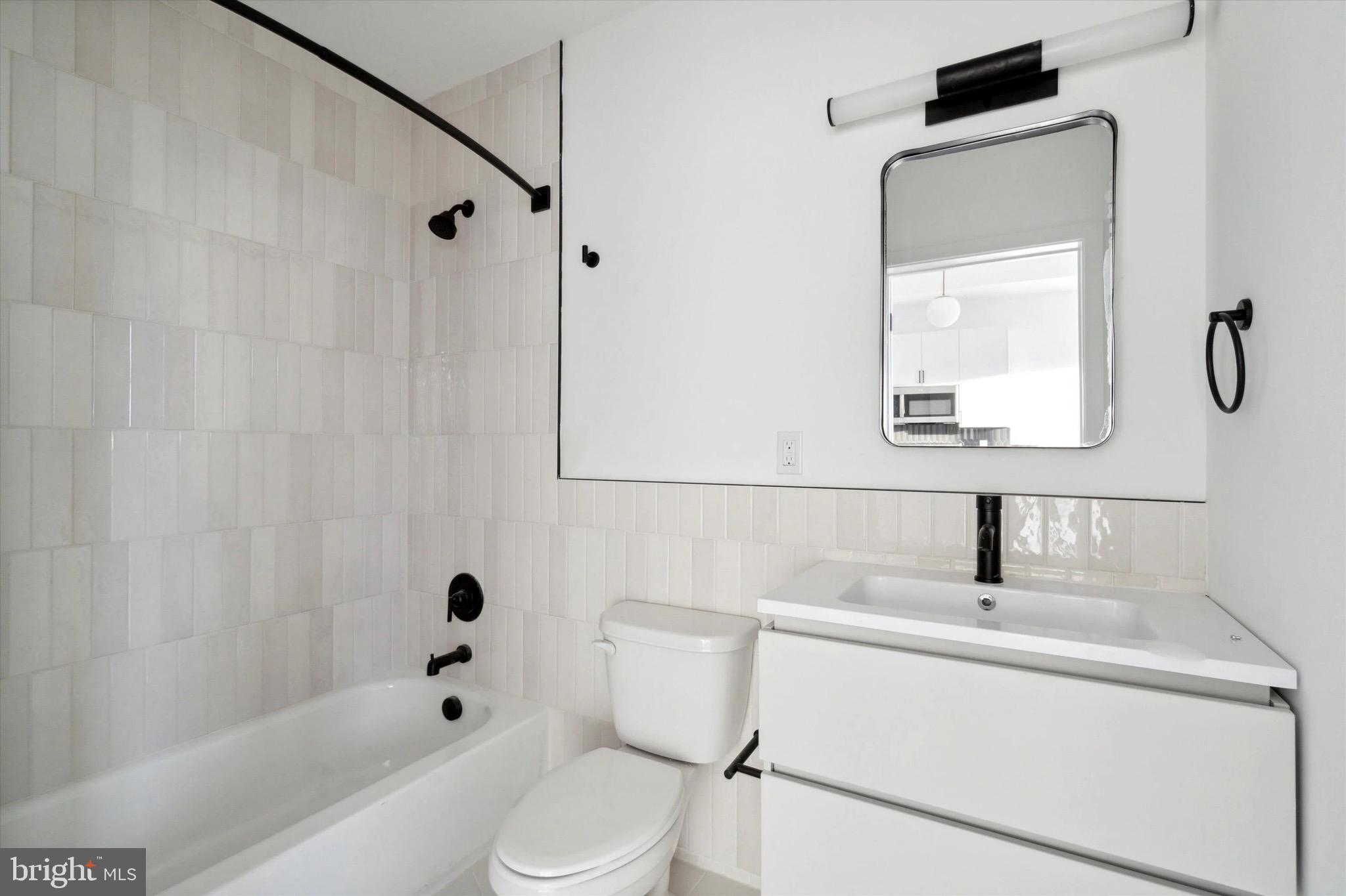 1643 North 2nd Street, Unit 302 Philadelphia, PA 19122 - Photo 10 of 40 a bathroom with a sink toilet and shower