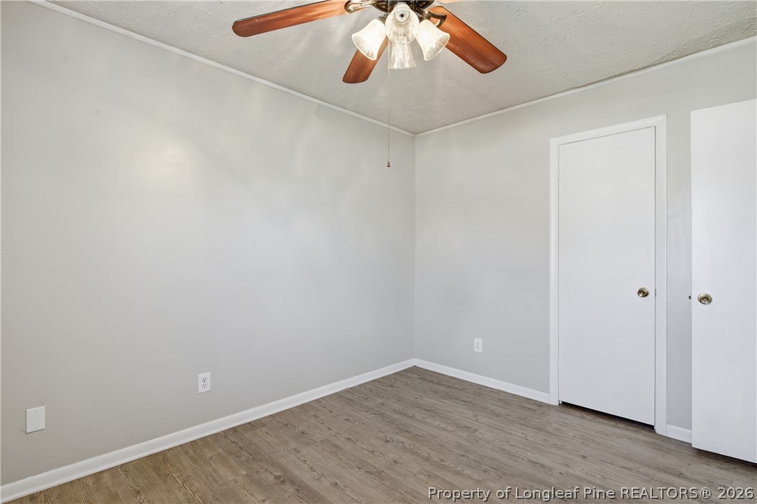 6319 Rustic Ridge Hope Mills, NC 28348 - Photo 32 of 39 wooden floor in an empty room