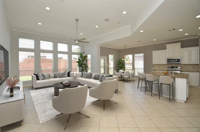 a spacious bathroom with a granite countertop sink a toilet a mirror and shower