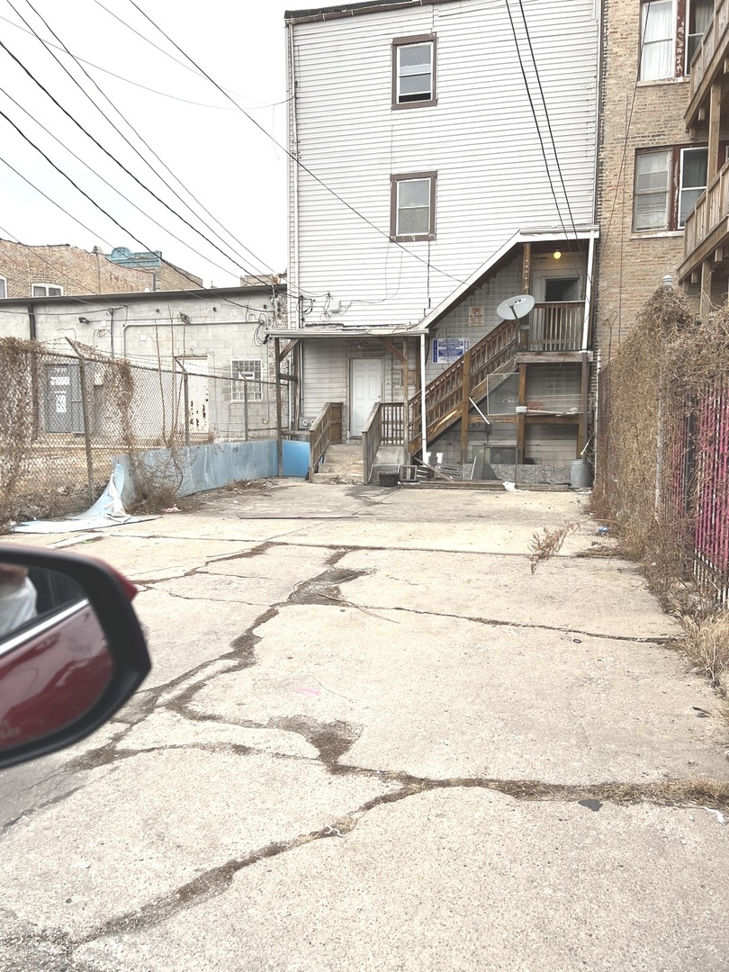 2825 West Cermak Road Chicago, IL 60623 - Photo 19 of 21 a view of a house with a patio