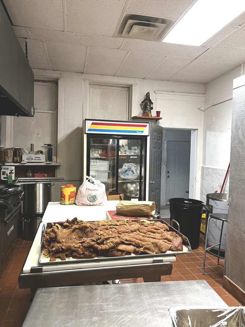 2825 West Cermak Road Chicago, IL 60623 - Photo 8 of 21 a bed sitting in a kitchen next to a window