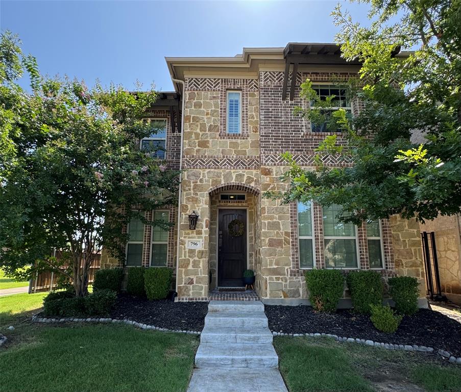 796 Huntingdon Street Coppell, TX 75019 - Photo 1 of 32 a front view of a house with garden