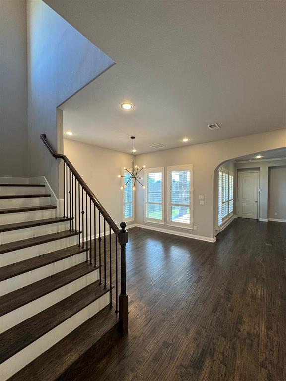 796 Huntingdon Street Coppell, TX 75019 - Photo 11 of 32 a view of a room with stairs and wooden floor