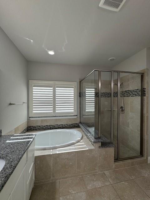796 Huntingdon Street Coppell, TX 75019 - Photo 27 of 32 a bathroom with a granite countertop bathtub and shower