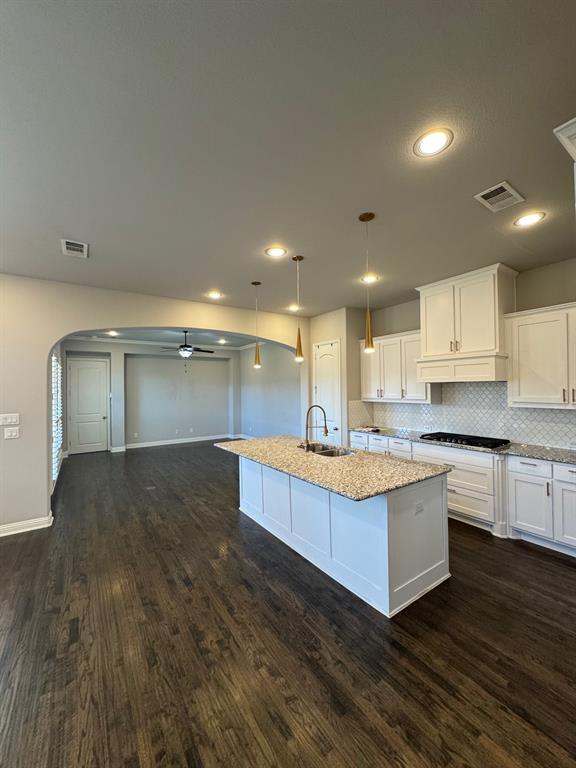 796 Huntingdon Street Coppell, TX 75019 - Photo 10 of 32 a view of kitchen with kitchen island wooden floor and center island