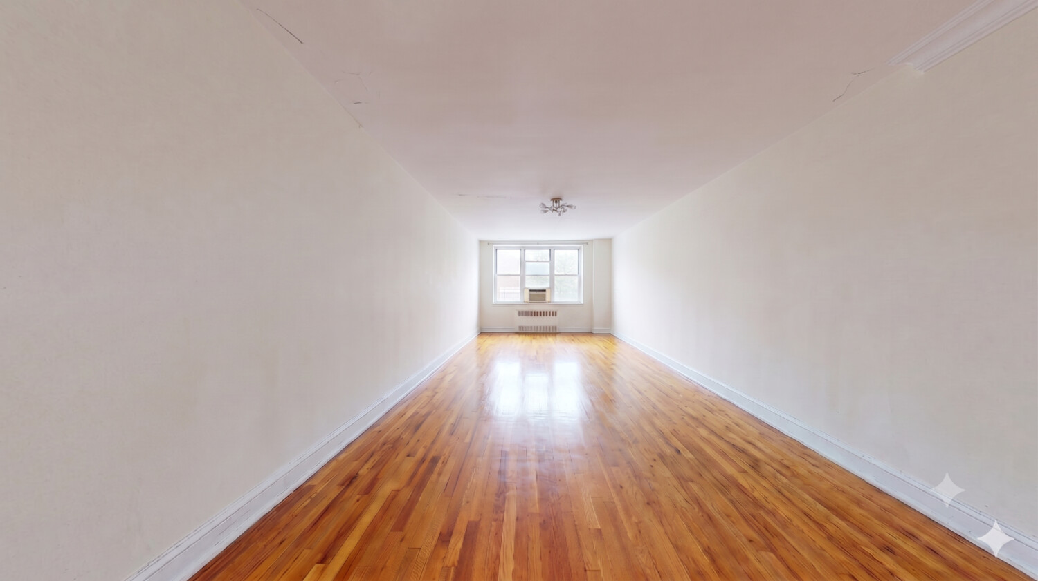 1200 Gravesend Neck Road, Unit 3L Brooklyn, NY 11229 - Photo 2 of 10 a view of empty room with wooden floor