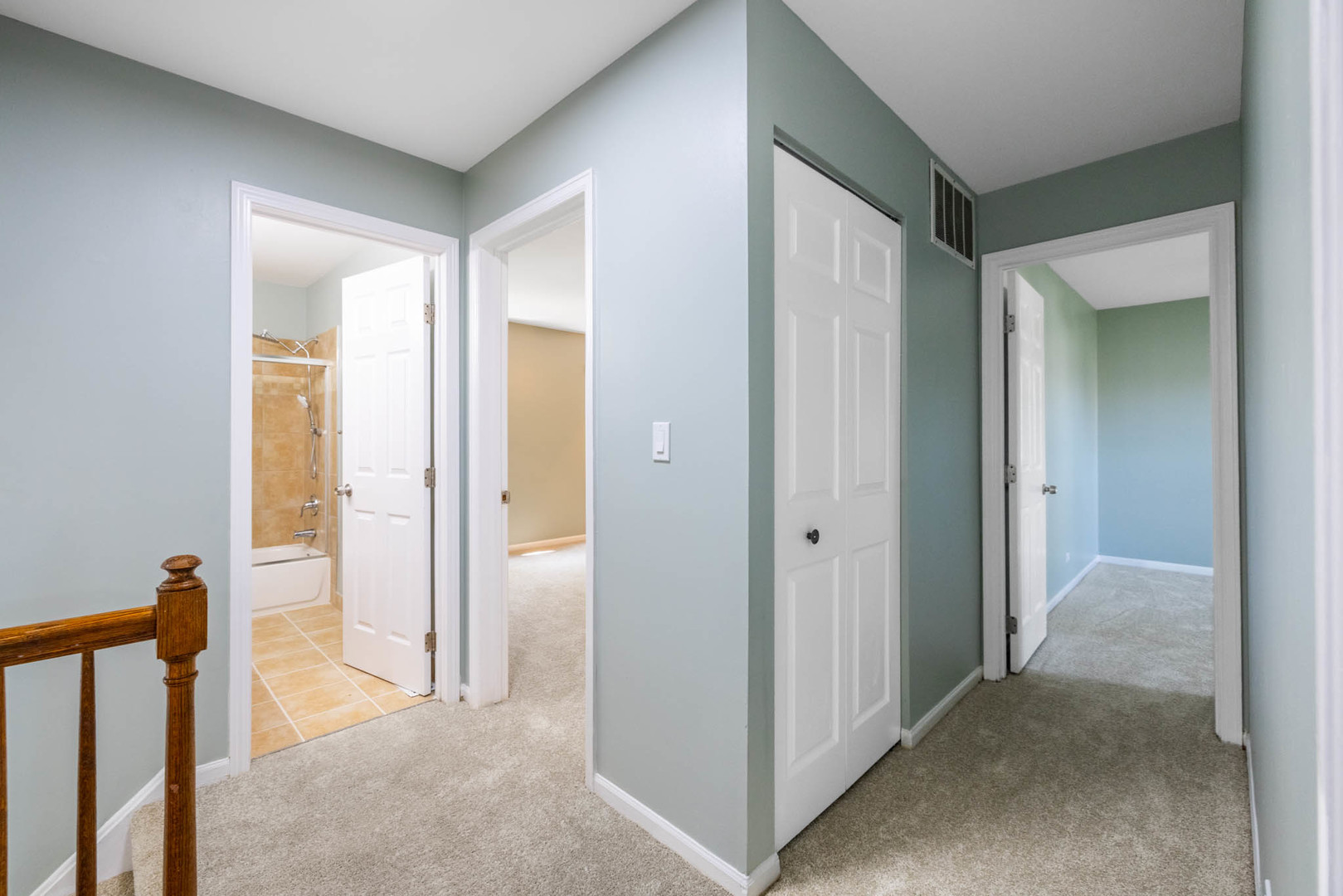 983 Stuart Drive Bartlett, IL 60103 - Photo 13 of 25 a view of a hallway with closet and a livingroom view