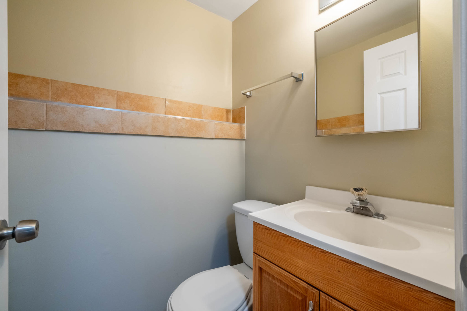 983 Stuart Drive Bartlett, IL 60103 - Photo 19 of 25 a bathroom with a sink and toilet