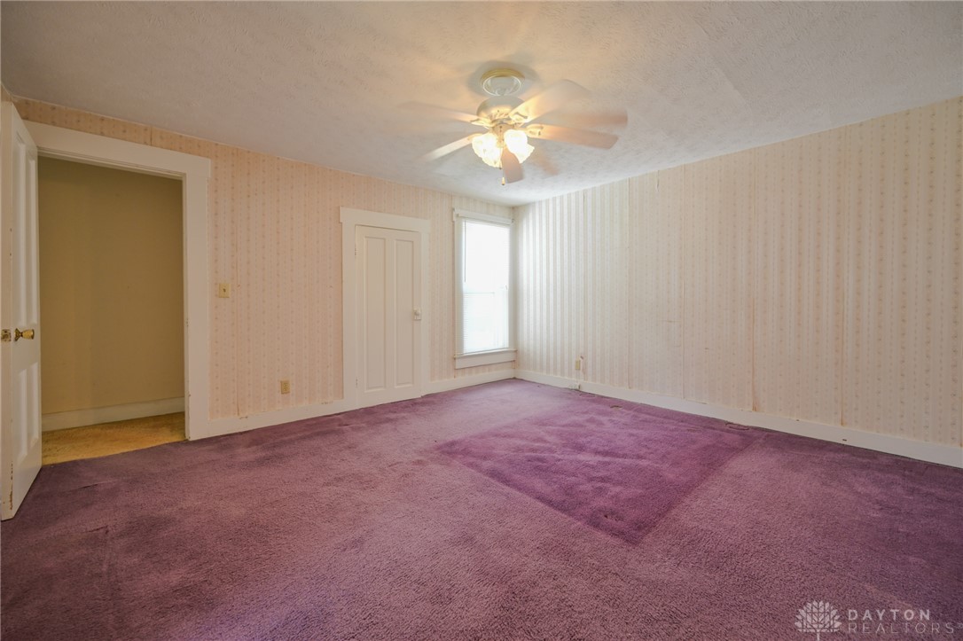 3057 Springfield Xenia Road Springfield, OH 45506 - Photo 6 of 37 This spacious bedroom offers ample natural light and a classic design palette.