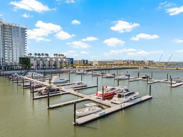 a view of a ocean with boats and water view