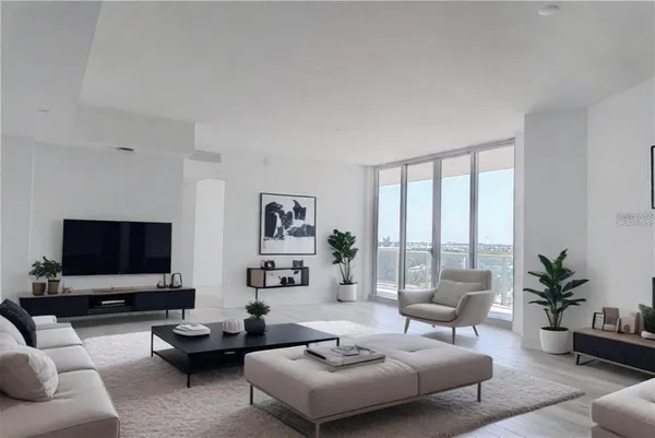 a living room with furniture and a flat screen tv