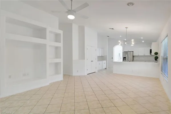 a kitchen with a sink and a stove top oven