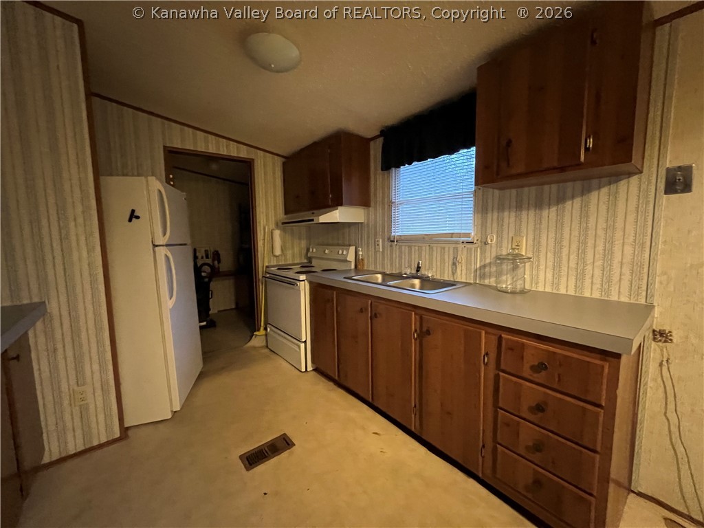 49 Jims Branch Road Lake, WV 25121 - Photo 3 of 17 KITCHEN INTO LAUNDRY