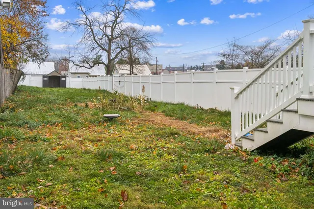 a view of a yard with an ocean view