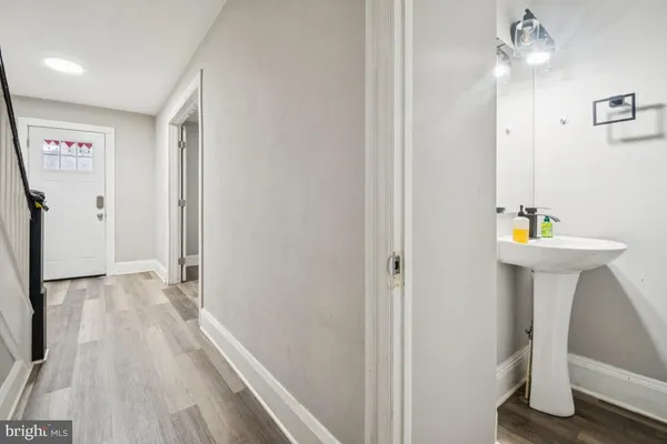 a view of hallway with sink