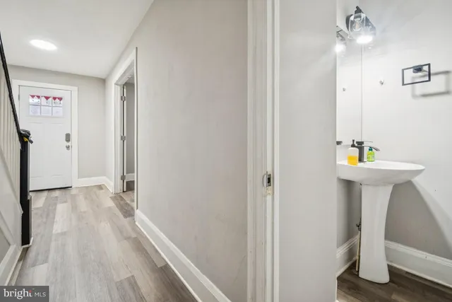 a view of hallway with sink