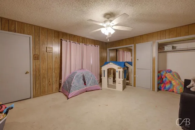 a bed room with a bed and a baby crib