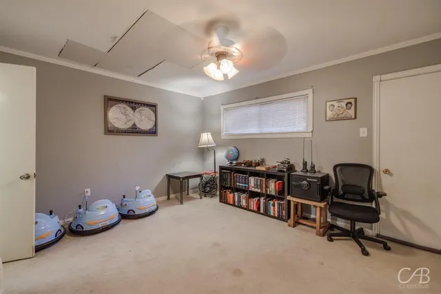a room with toys and a chandelier fan